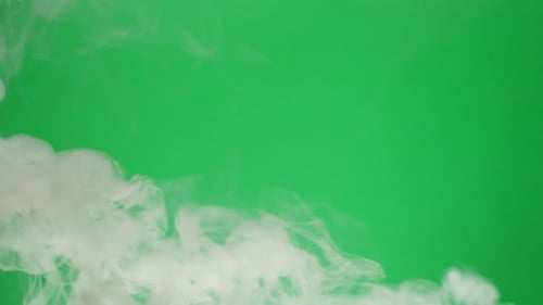 Smoke on Green Chroma Key Background Smoking Steam Clouds of Vapour Closeup Burning Fog