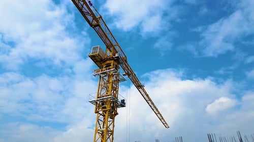 Tower crane working on a multi-story construction site