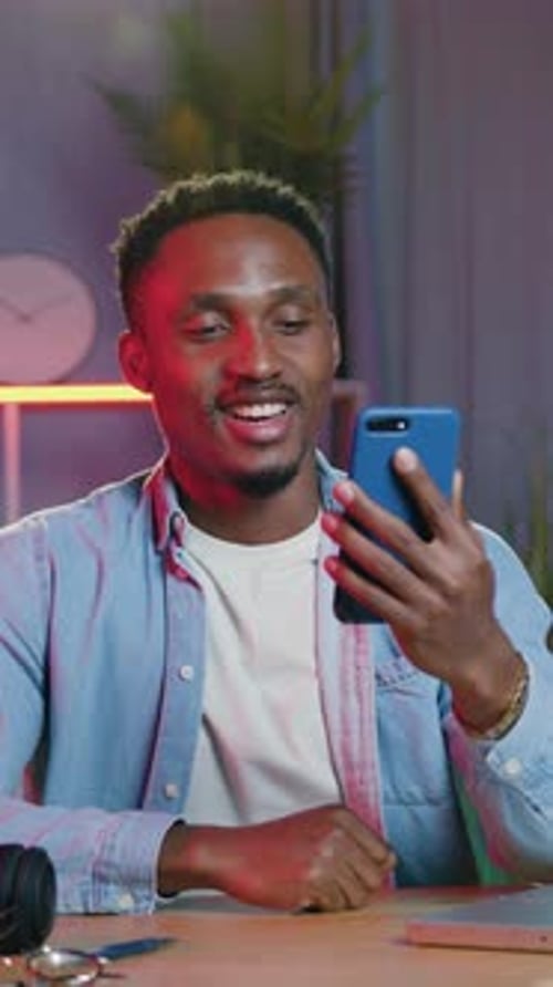 Man on Video Call Waving and Talking Indoors