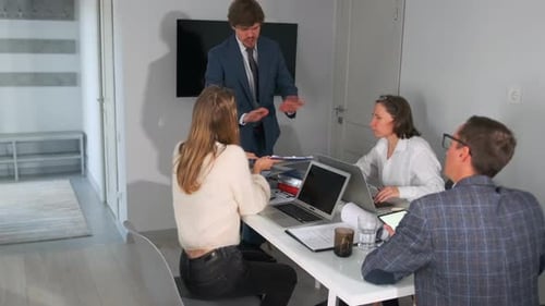Stressed Office Team Working with Documents Before Deadline