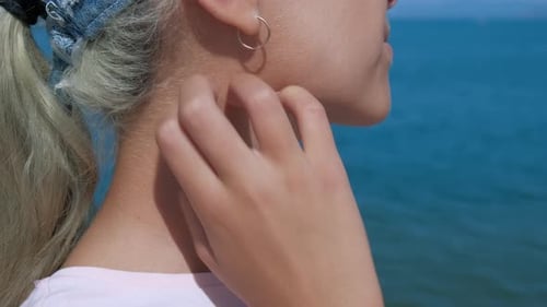 Young Woman Scratching Itchy Skin on Neck