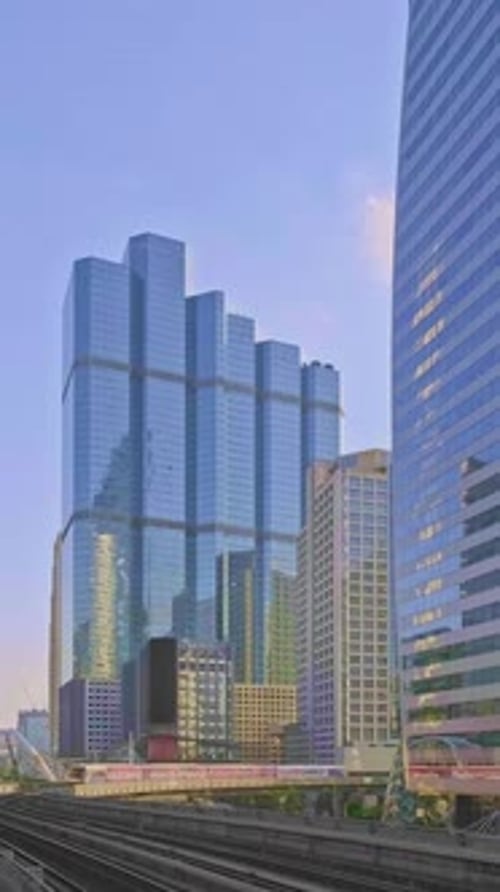 Train Passing Business Downtown of Modern City of Skyscrapers