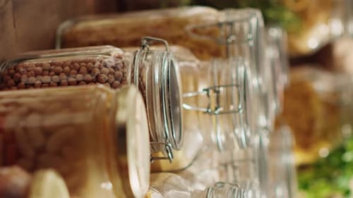 Vertical Video Eco Store Pantry Items in Reusable Jars