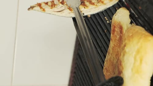 Toasting bread on a restaurant grill