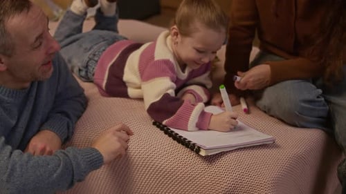 Parents Doing Homework with Kid