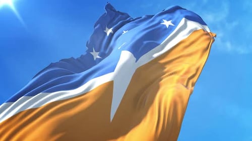 Waving Flag Against Blue Sky with Lens Flare