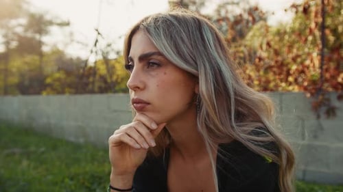 Woman Contemplating in Autumn Sunlight