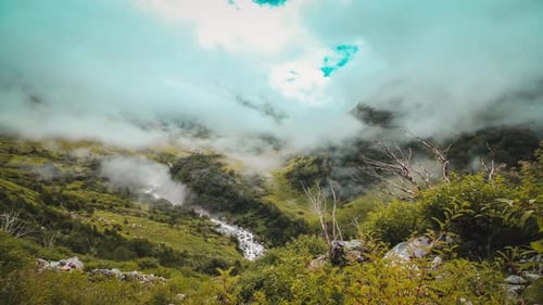 Time lapse footage of moving clouds on a himalayan valley