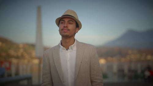 Fashionable Young Handsome Man Wearing a Hat and Casual Clothes in the City