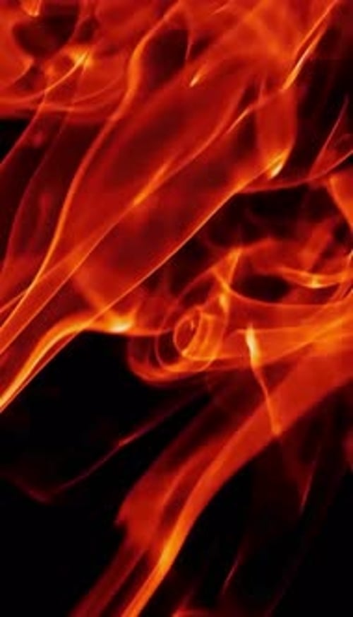 Abstract Orange Smoke Rises on Black Background