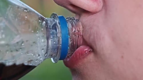 Child Drinking Soda Close Up