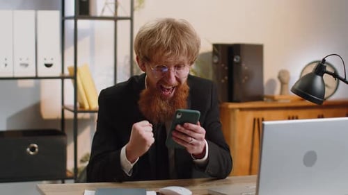 Businessman Shocked By Sudden Victory on Smartphone Game Winning Lottery Goal Achievemen Good News