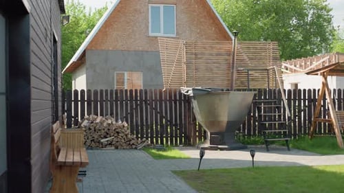 Outdoor Hot Tub and Swing in Suburban Garden