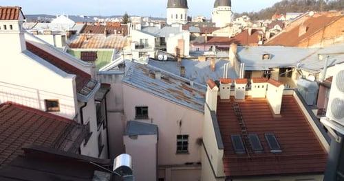 Architecture of an old European city. Shooting tiled roofs and chimneys.