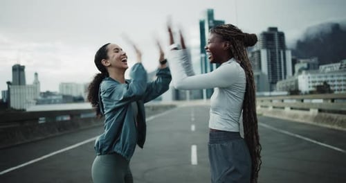 Runner, happy and high five with women in city for workout partner, health and training goal
