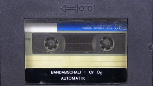 Vintage Audio Cassette Tape Playing in Player