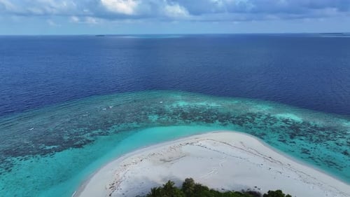 Aerial view of island with white sand, Maldives.
