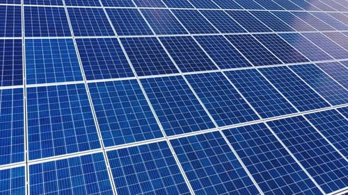 Blue solar panel close-up. Alternative source of electricity on solar energy farm.