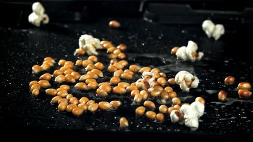 Popcorn Explodes in a Pan with a Splash of Oil Filmed on a Highspeed Camera at 1000 Fps