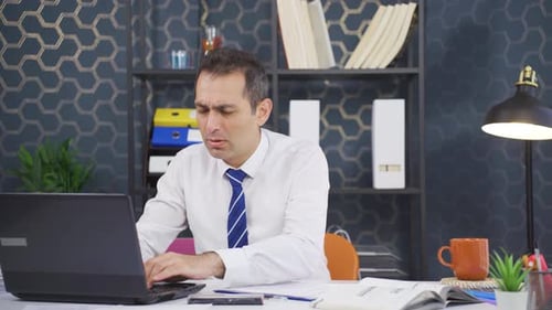 Man Massaging Sore Shoulder and Neck in Office