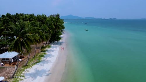 Koh Mook Island on a Sunny Day Thai Beach with Turqouse Colored Ocean During Summer