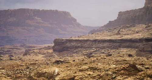 Vast Stretches of Dry Earth Form a Dramatic Desert Landscape Under a Bright Sky