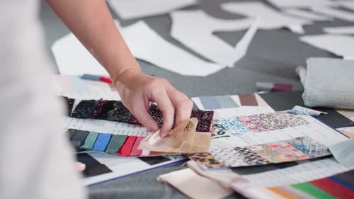 Designer Choosing Fabric Samples in Studio