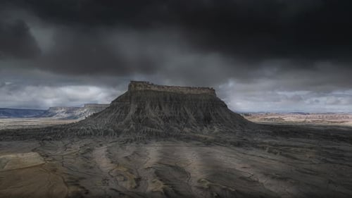 Exploring a Mysterious Mesa Under Stormy and Dramatic Skies of Barren Beauty and Majesty