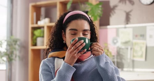 Smile, drinking coffee or woman in apartment to relax in lounge for cup of hot chocolate