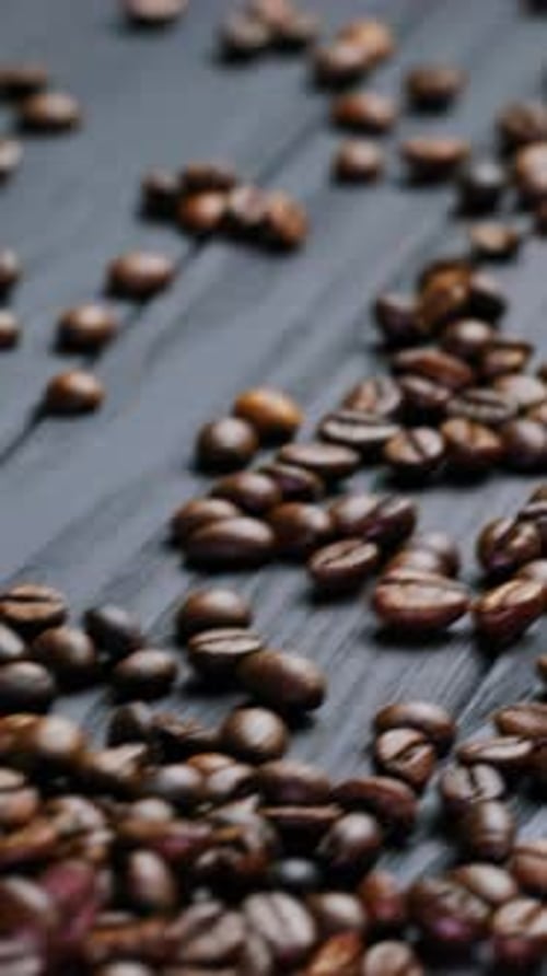 Burlap Bag Dropped Onto Coffee Beans