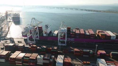 Logistics and Transportation of Container Cargo Ship with Working Crane Bridge in Shipyard