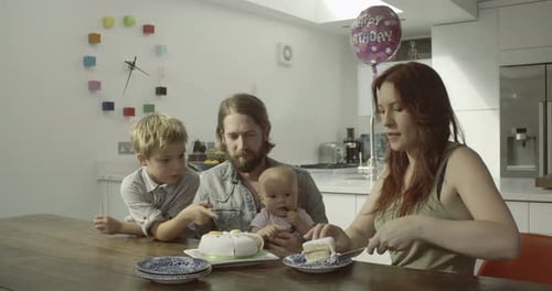 Family Celebrating Birthday in Bright Modern Kitchen