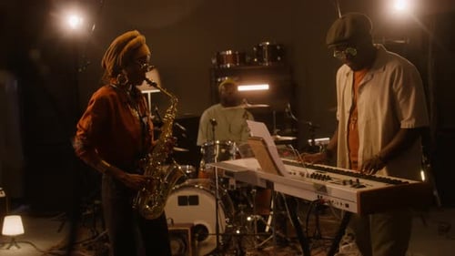 African American Jazz Band Rehearsing Together in Studio