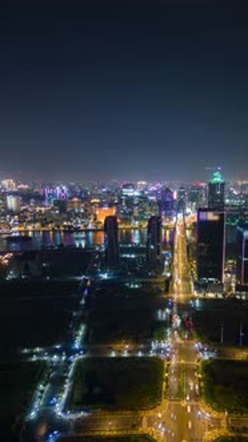 Night Timelapse of Ho Chi Minh City Skyline with Traffic and Glowing City Lights