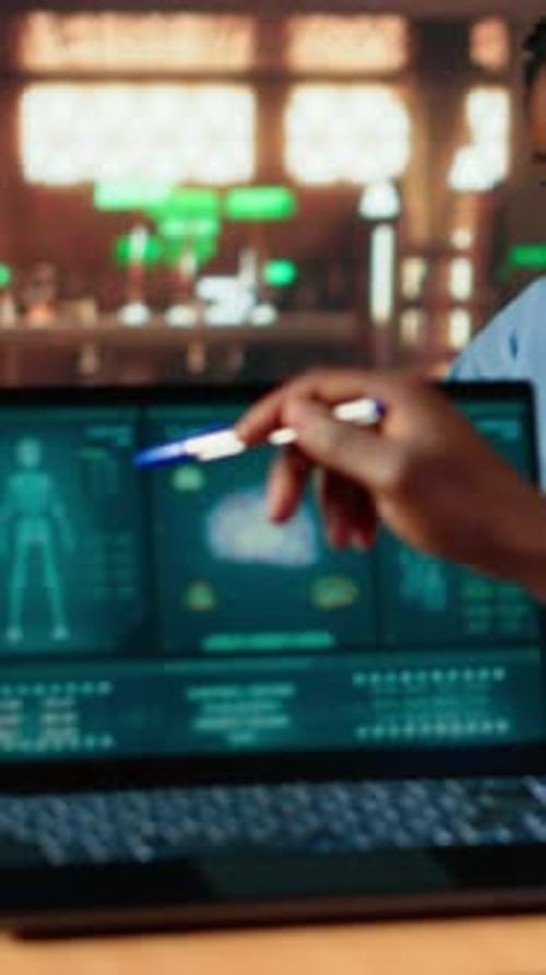 Vertical Video Black Med School Scholar Studying and Taking Notes Using Online Information