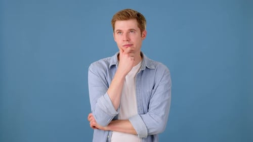 Thoughtful Man Thinking on Blue Background