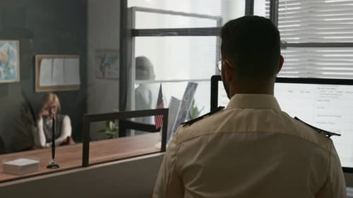 Worker helping client in a government office