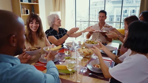 Friends and Family Sharing Food at Dinner Table