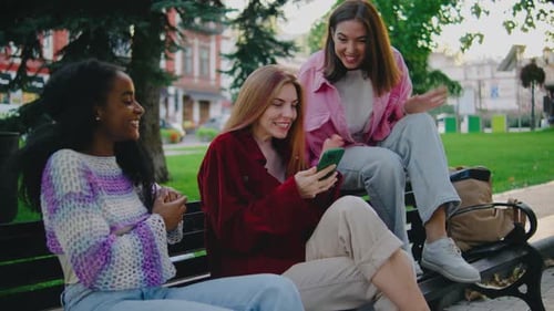A Group of Friends Truly Enjoying Their Time Together While Spending the Day in a Vibrant Park One