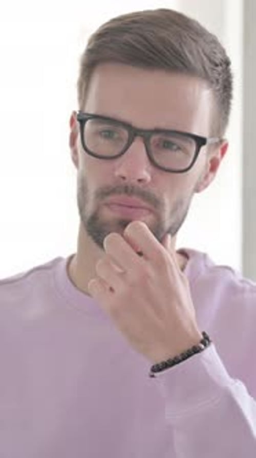 Portrait of Pensive Young Man Thinking New Plan, Vertical Video