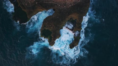 Waves Crashing and Splashing on the Rocky Shore Drone View