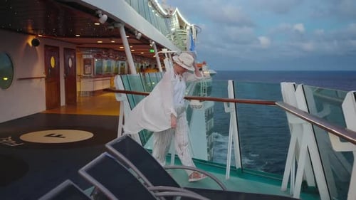 Woman Enjoys Ocean View on Luxury Cruise Ship
