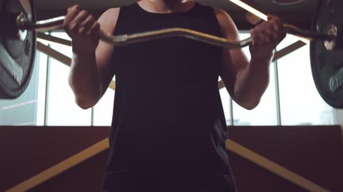 Athletic Handsome Male Sportsman Working in the Gym Using Barbell Strong and Healthy Bodybuilder