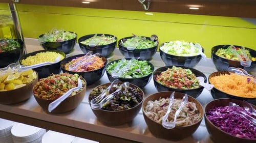salads in bowls at the buffet. Shot of salad varieties in bowls. 4K.