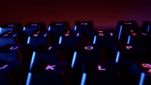 Close-up of Buttons of Black Keyboard in Colorful Backlight