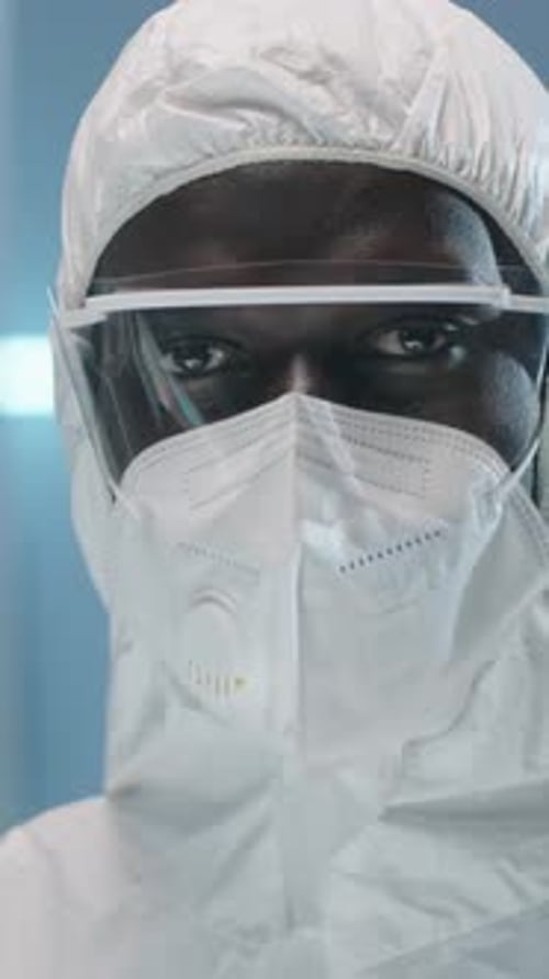 Subject in Hazmat Suit Looking at Camera