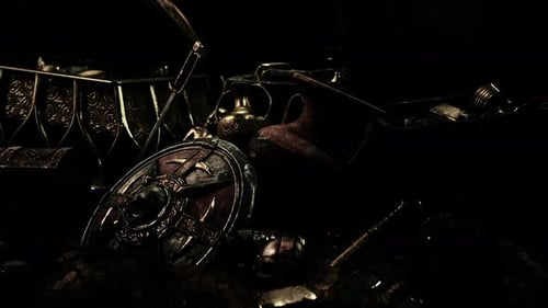 Handful of Gold Jewelry on a Dark Background