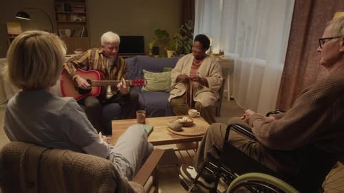 Talented Senior Singing to Guitar to Welcoming Nursing Home Community