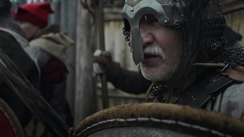 Mature Warrior in Helmet, with Sword and Shield Defending Fort with Comrades