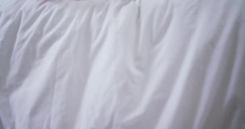 Romantic Couple Relaxing in Bed, Close Up on Feet